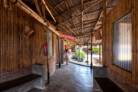 Community Spaces in Rohingya Refugee Response, Cox’s Bazar (Bangladesh) | Shantikhana Women Friendly Space in Camp 4ext: Eight main rooms of different shapes are arranged in a horse-shoe pattern around a central courtyard. A large roof made of bamboo and palm leaves covers all the rooms and interstitial areas, creating semioutdoor informal spaces. | © Aga Khan Trust for Culture / Asif Salman (photographer)